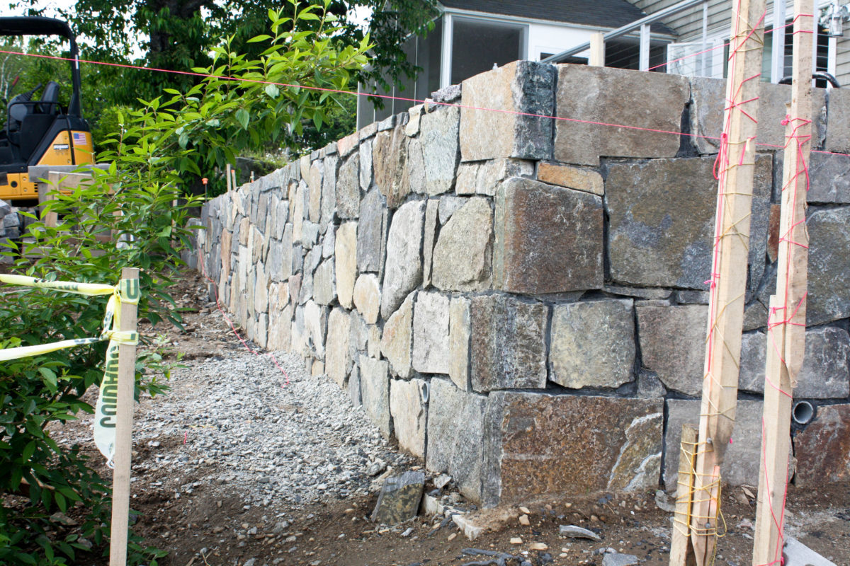 stone wall being built