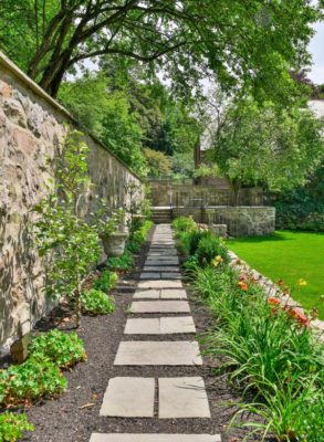 natural stone pathway through backyard