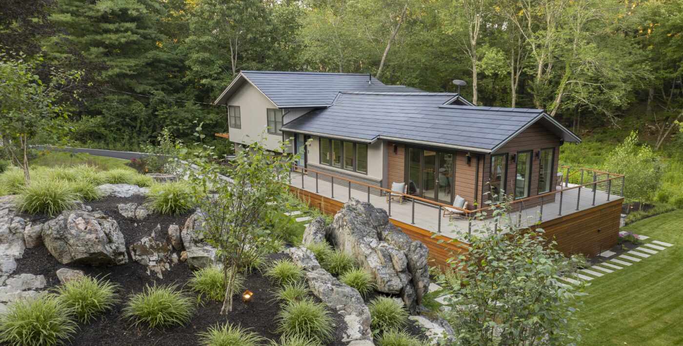 modern home, Tesla solar roof, hillside, plantings, lighting